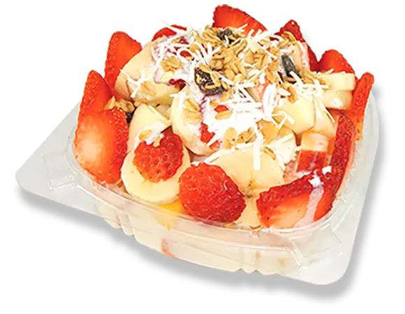a tray of bananas and strawberries with cream and toppings.