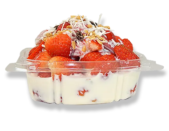 a tray of strawberries with cream and toppings.